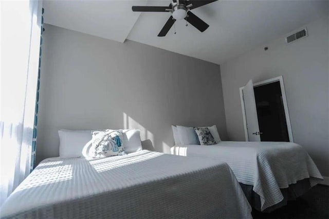 bedroom featuring lofted ceiling and ceiling fan