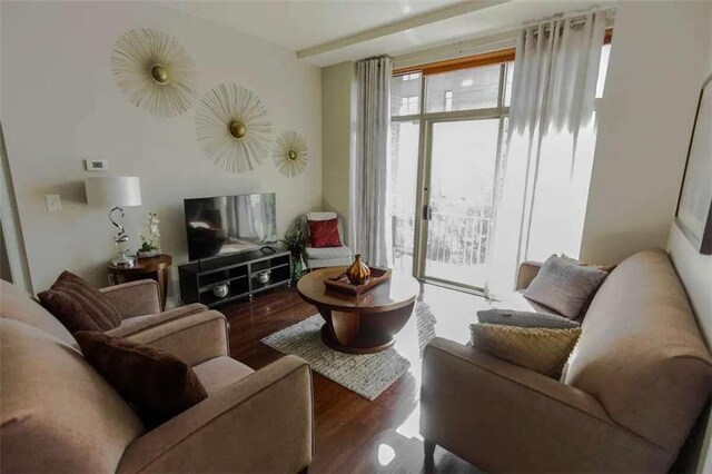 sitting room featuring dark wood-type flooring