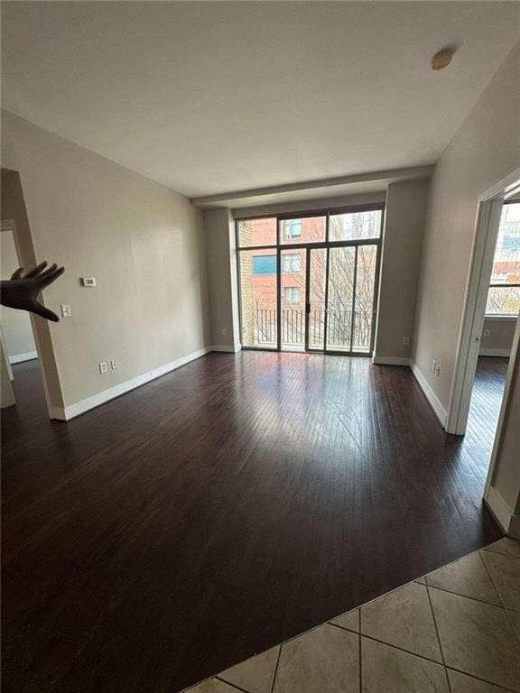 unfurnished living room featuring dark hardwood / wood-style flooring