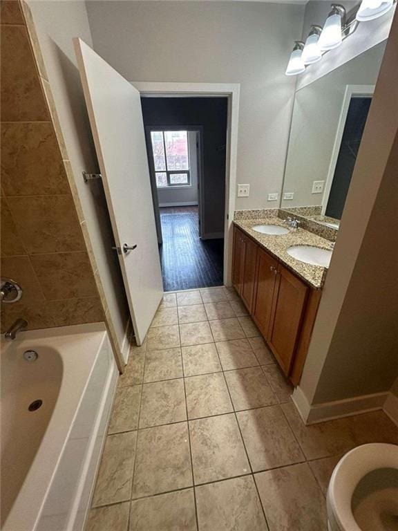 bathroom with a bathing tub, hardwood / wood-style floors, and vanity