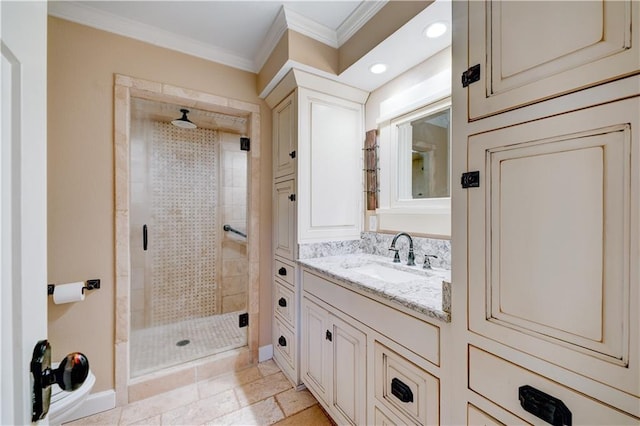 bathroom with a stall shower, baseboards, ornamental molding, vanity, and recessed lighting