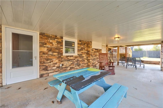 view of patio featuring fence