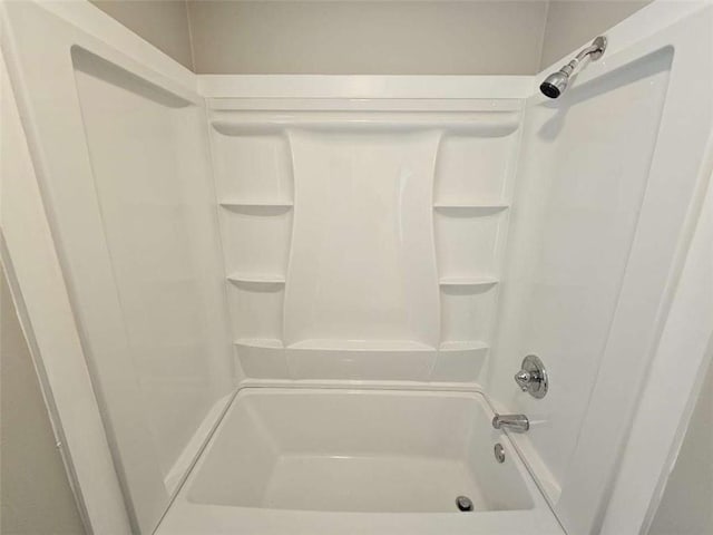 unfurnished bedroom featuring baseboards, ceiling fan, carpet, and two closets