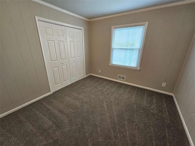 unfurnished bedroom with baseboards, a closet, and carpet floors