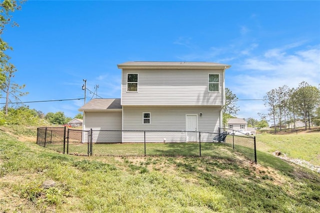 rear view of house with a gate