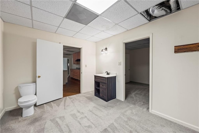 unfurnished room featuring light colored carpet and a paneled ceiling