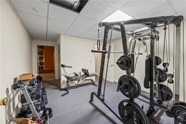 workout room featuring a paneled ceiling