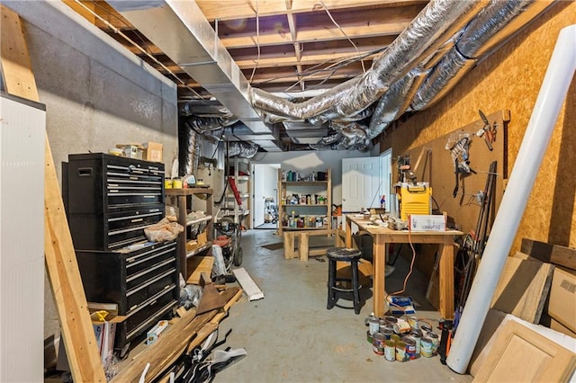 unfinished below grade area with a workshop area