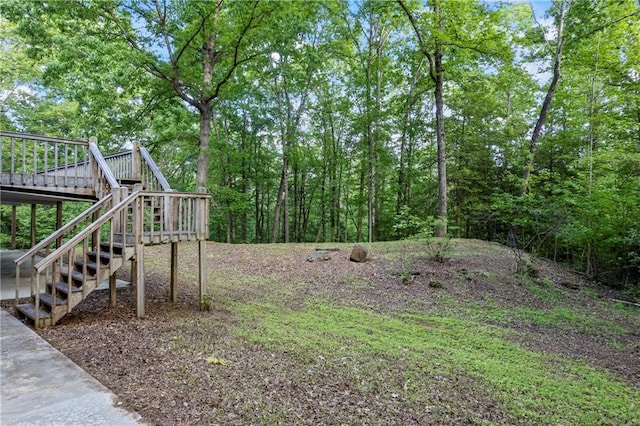 view of yard featuring stairway and a wooden deck