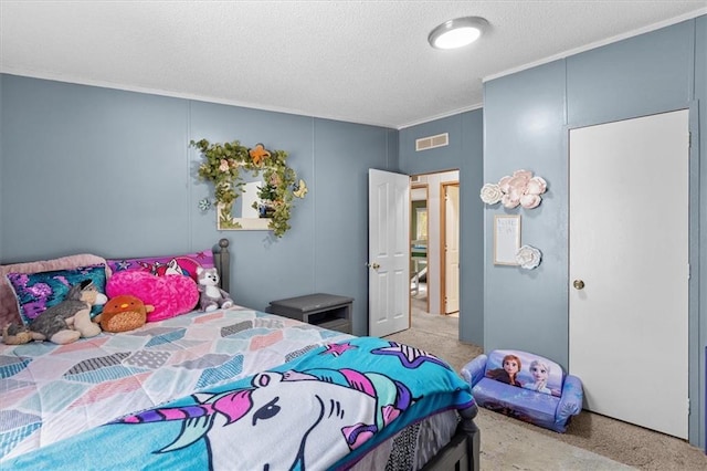 bedroom featuring a textured ceiling and visible vents