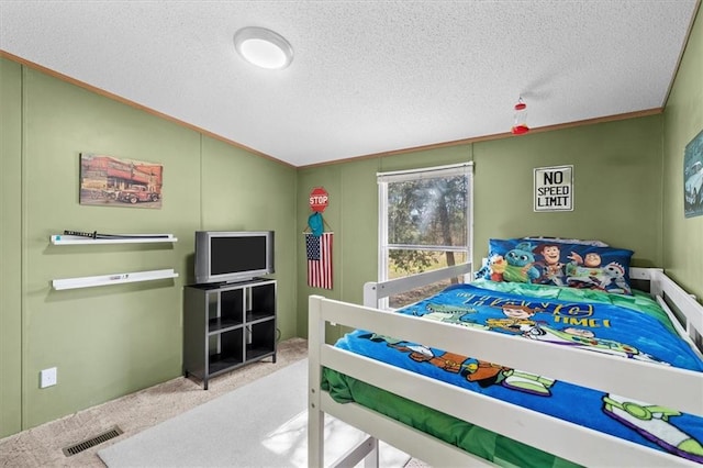 carpeted bedroom with lofted ceiling, a textured ceiling, and visible vents