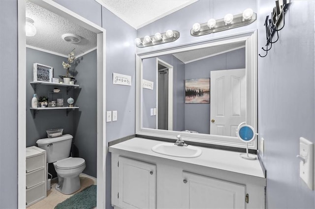 bathroom featuring a textured ceiling, vanity, toilet, and crown molding