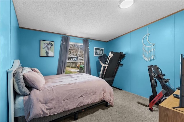 bedroom featuring carpet floors, crown molding, and a textured ceiling