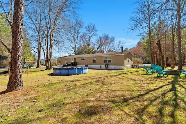 view of yard featuring a covered pool