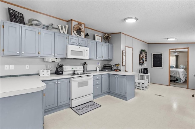 kitchen featuring crown molding, light floors, light countertops, gray cabinetry, and white appliances