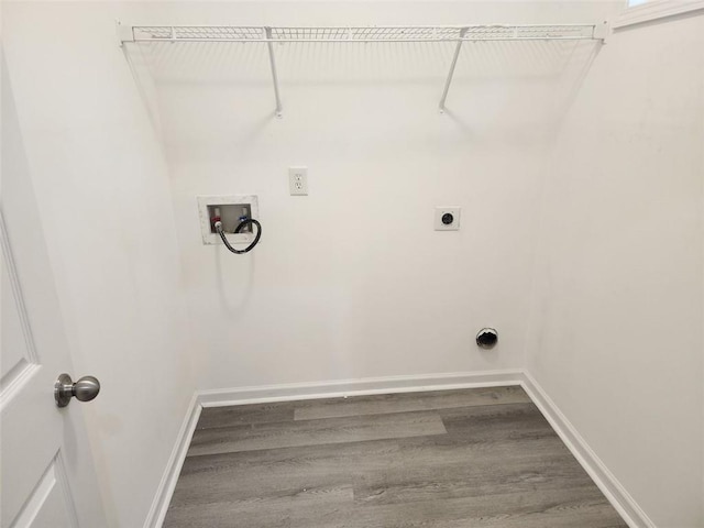 washroom featuring hardwood / wood-style floors, hookup for an electric dryer, and hookup for a washing machine