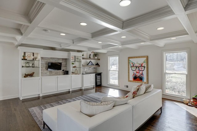 living room with dark wood-type flooring, coffered ceiling, crown molding, indoor bar, and beamed ceiling