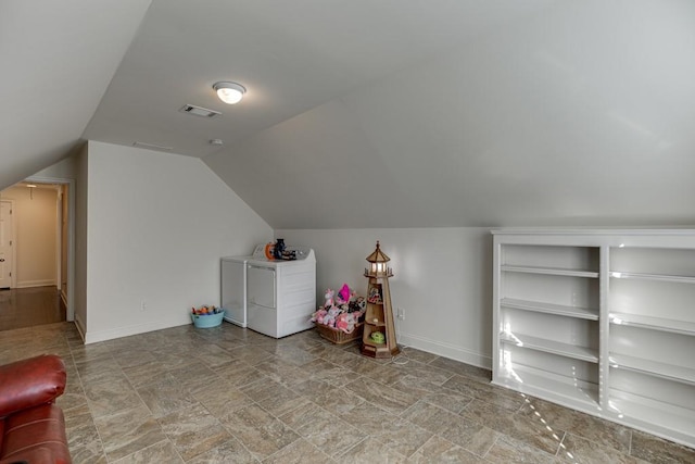 additional living space with independent washer and dryer and vaulted ceiling