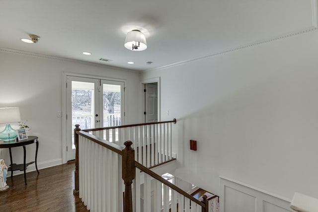 hallway featuring ornamental molding, french doors, and dark wood-type flooring