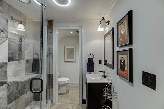 bathroom featuring vanity, toilet, a shower with door, and crown molding