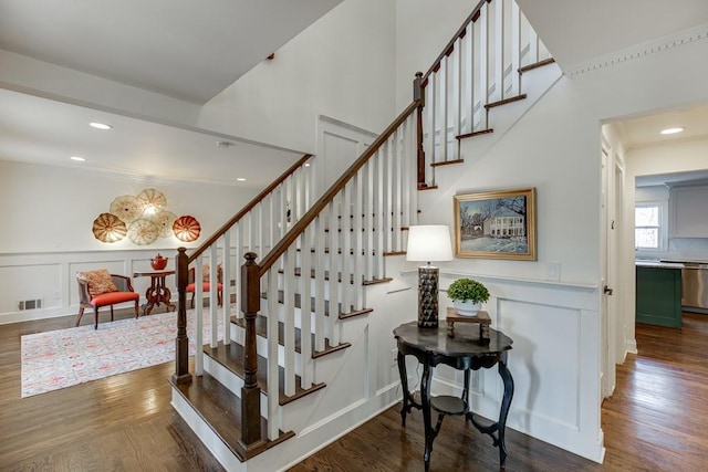 staircase with hardwood / wood-style flooring