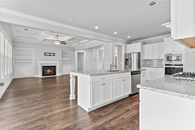 840 Champagne Ln, Hoschton, GA 30548 - kitchen featuring appliances with stainless steel finishes, open floor plan, a sink, a ceiling fan, and recessed lighting