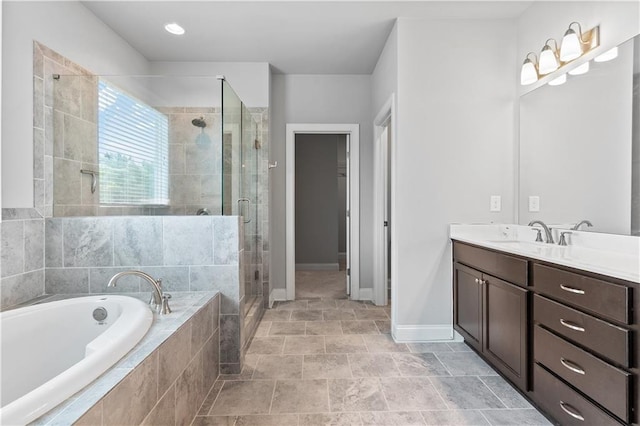 840 Champagne Ln, Hoschton, GA 30548 - bathroom featuring vanity, a bath, a shower stall, and baseboards
