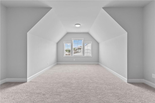 840 Champagne Ln, Hoschton, GA 30548 - bonus room with carpet flooring, vaulted ceiling, and baseboards