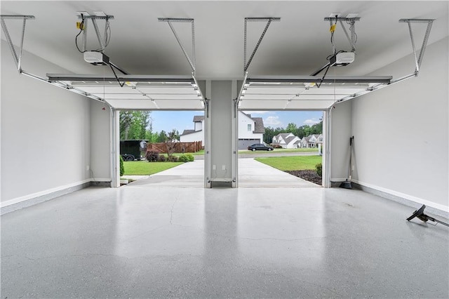 840 Champagne Ln, Hoschton, GA 30548 - garage with a garage door opener and baseboards
