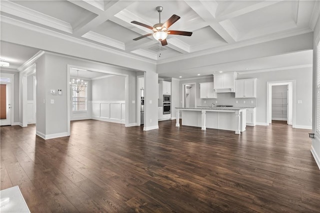 840 Champagne Ln, Hoschton, GA 30548 - unfurnished living room with ceiling fan, dark wood finished floors, beamed ceiling, a chandelier, and coffered ceiling