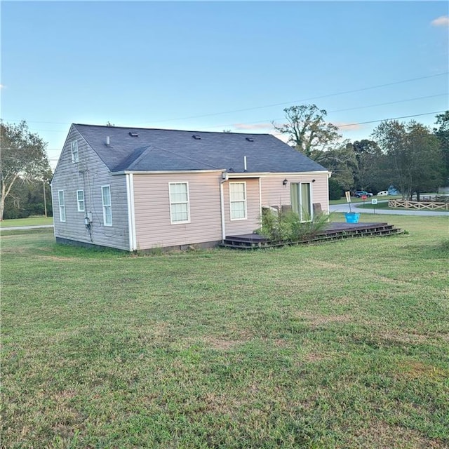 back of house with a yard