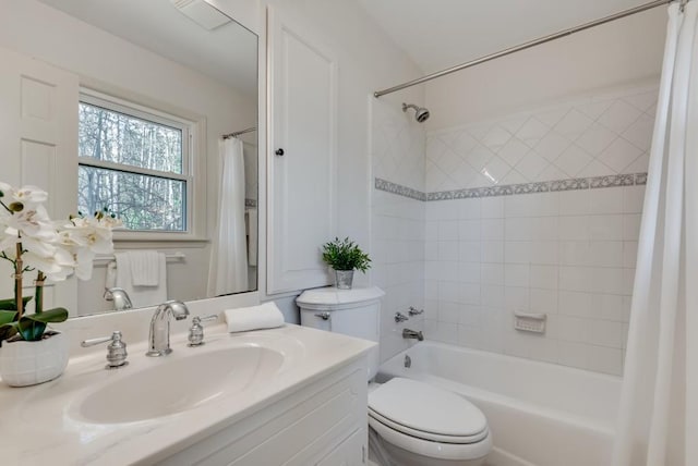 full bathroom featuring toilet, vanity, and shower / bath combo with shower curtain