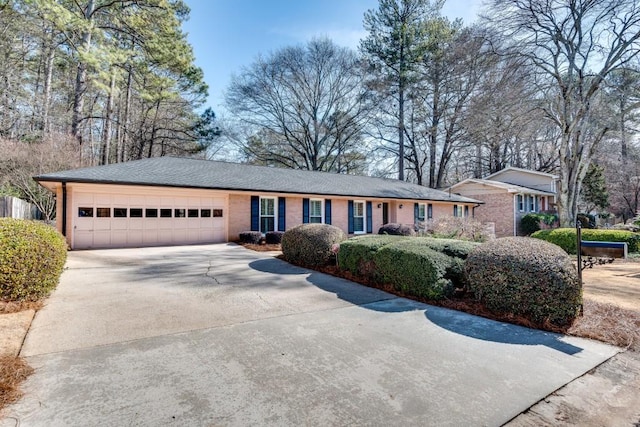 ranch-style house featuring a garage