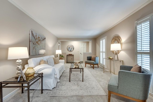 carpeted living room with ornamental molding