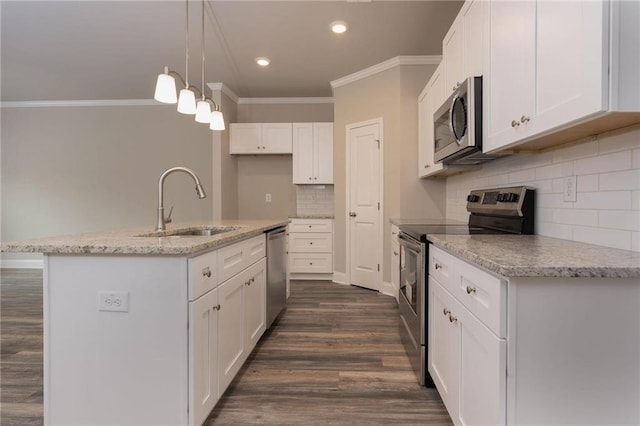 kitchen featuring sink, white cabinetry, a kitchen island with sink, stainless steel appliances, and decorative light fixtures