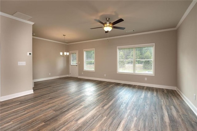 empty room featuring crown molding, dark wood-type flooring, and ceiling fan with notable chandelier