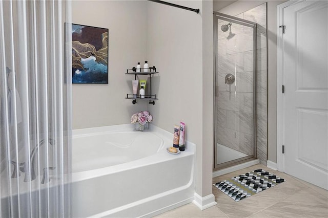 bathroom featuring shower with separate bathtub and tile patterned floors