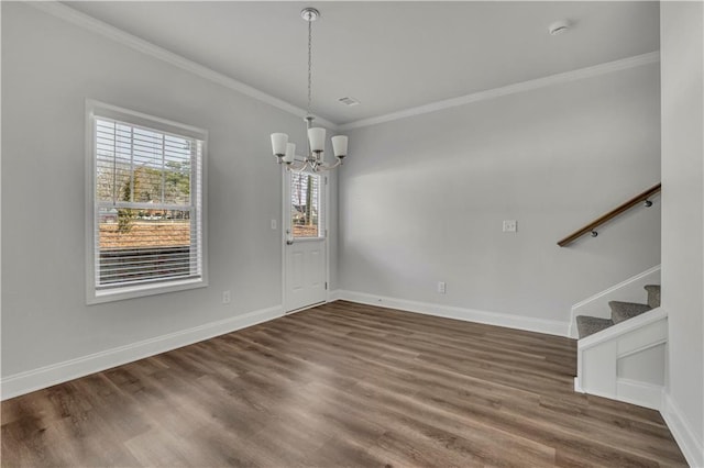 unfurnished dining area with ornamental molding, dark hardwood / wood-style floors, and a notable chandelier