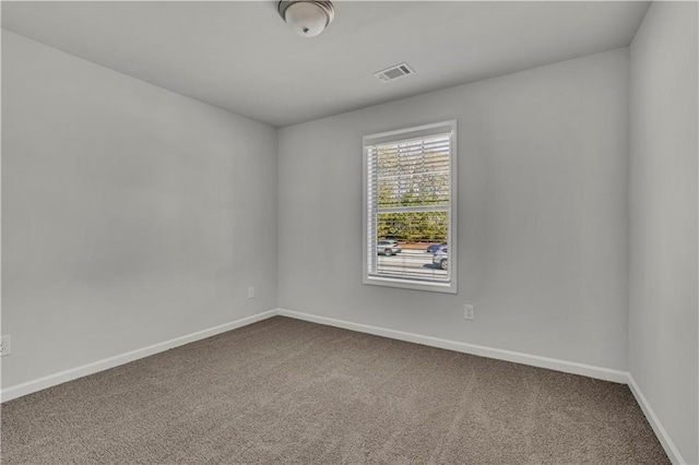 spare room with carpet floors