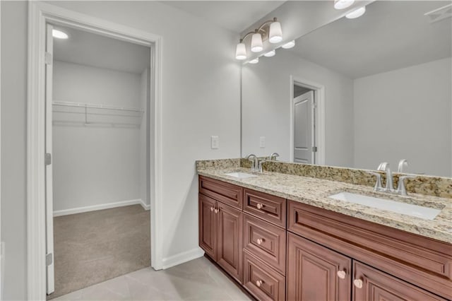 bathroom with vanity and tile patterned flooring