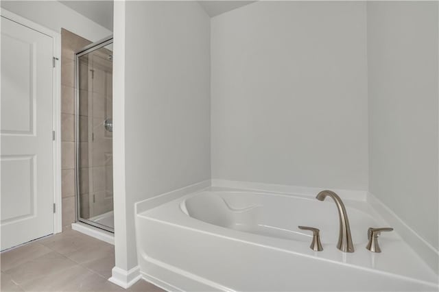 bathroom featuring separate shower and tub and tile patterned flooring