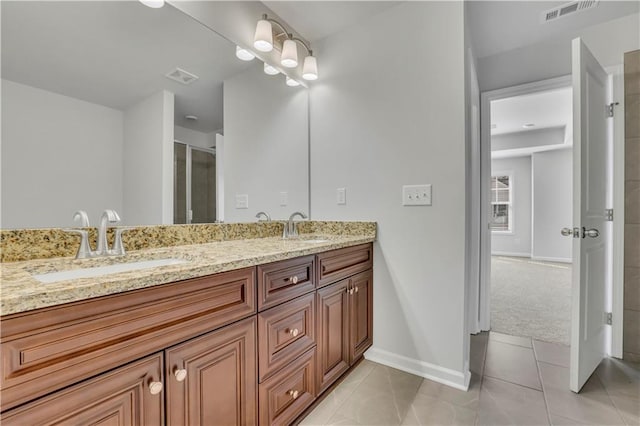 bathroom featuring vanity and tile patterned flooring