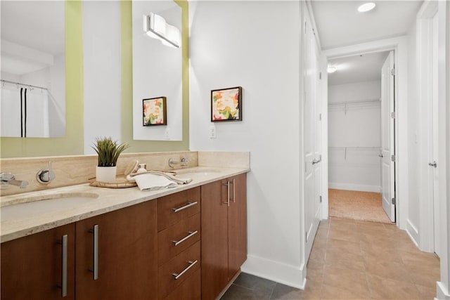 bathroom featuring tile patterned floors and vanity