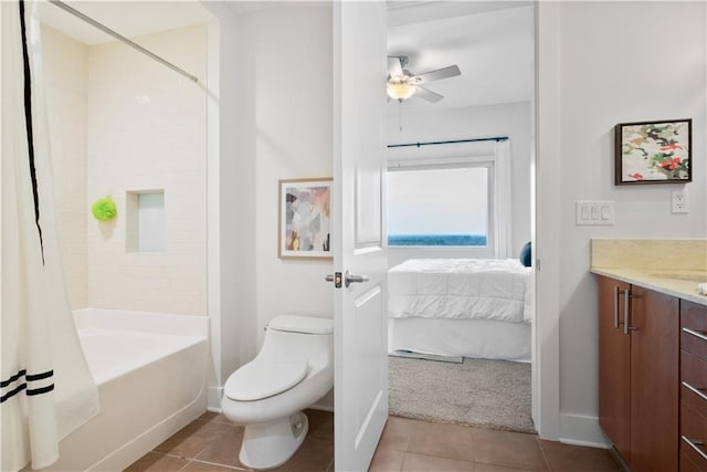 full bathroom featuring ceiling fan, shower / tub combo, vanity, tile patterned floors, and toilet