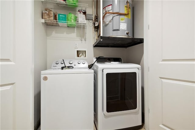 laundry area featuring water heater and washer and dryer