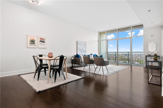 dining room with dark wood-type flooring and floor to ceiling windows