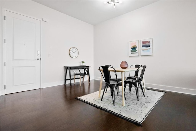 dining area featuring dark hardwood / wood-style flooring