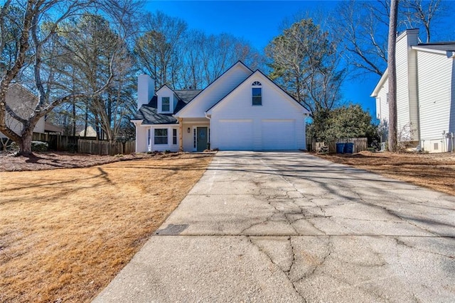 cape cod-style house with a garage