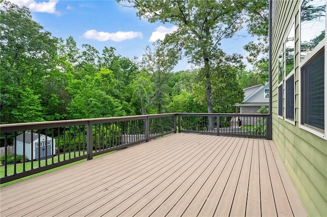 deck with a storage shed and an outdoor structure