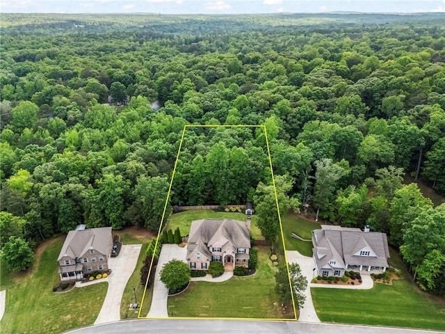 aerial overview of property's location featuring a forest and property parcel outlined